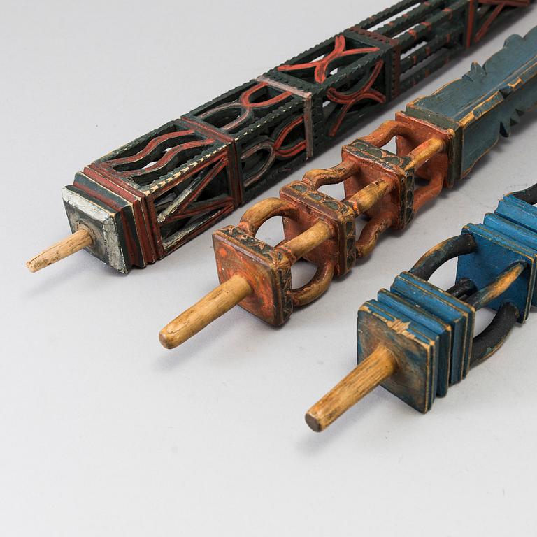 Three painted folk art flax ornaments 19th century.