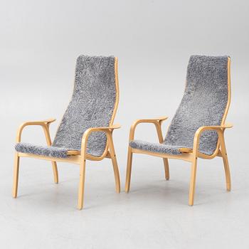 Yngve Ekström, a pair of 'Lamino' armchairs, Swedese, Sweden, 2011.
