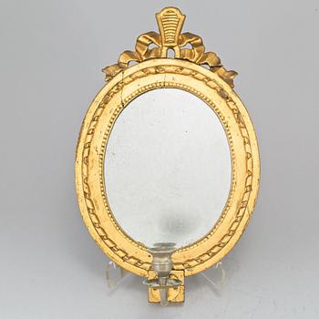 A late 18th century gustavian one-light girandole mirror.