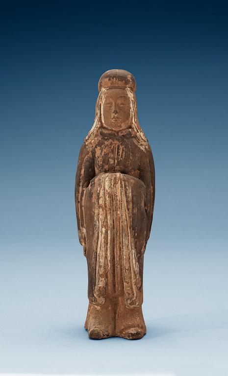 A painted pottery figure of a standing female, Tang dynasty (618-907).