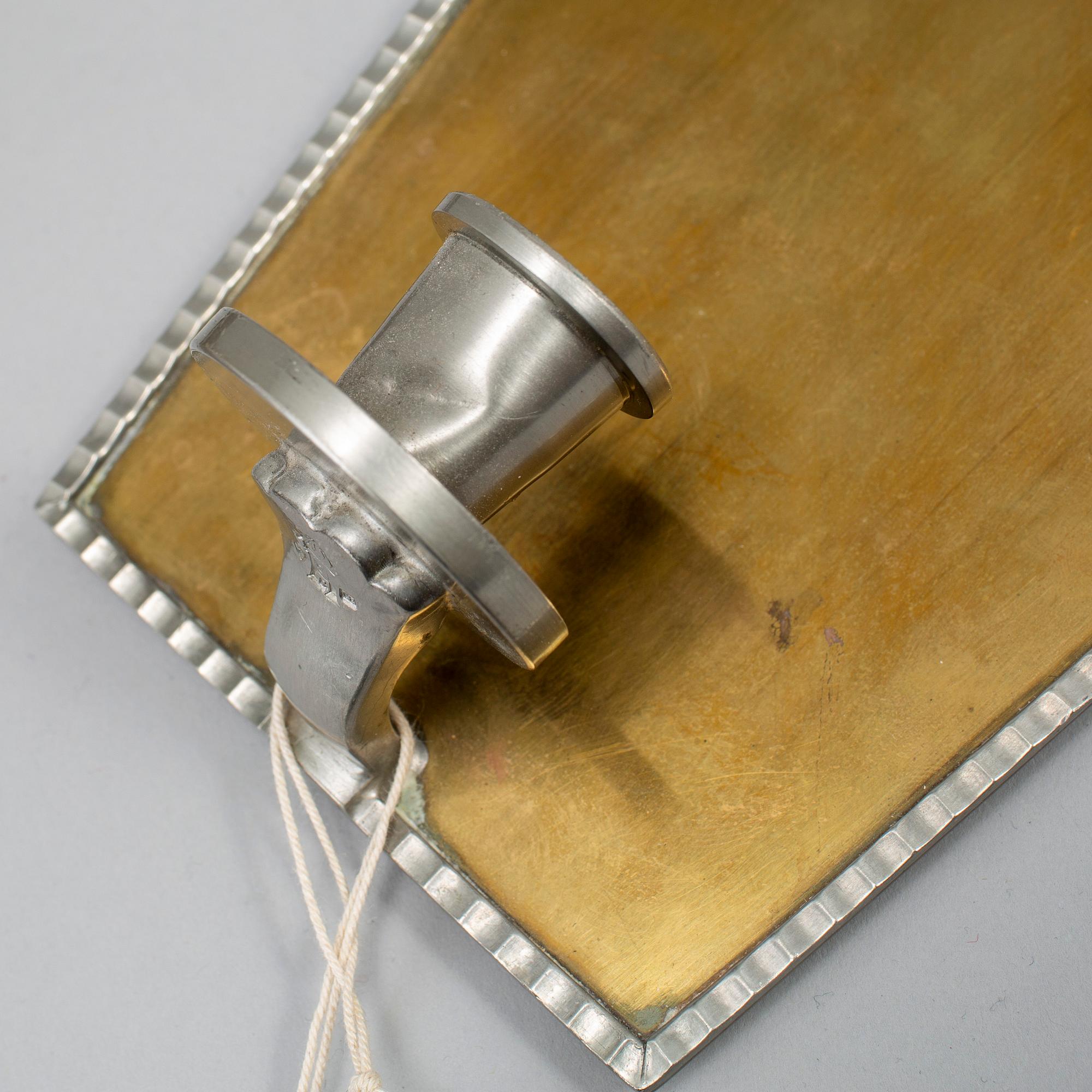 A pair of wall sconces by CG Hallebrg dated 1929.