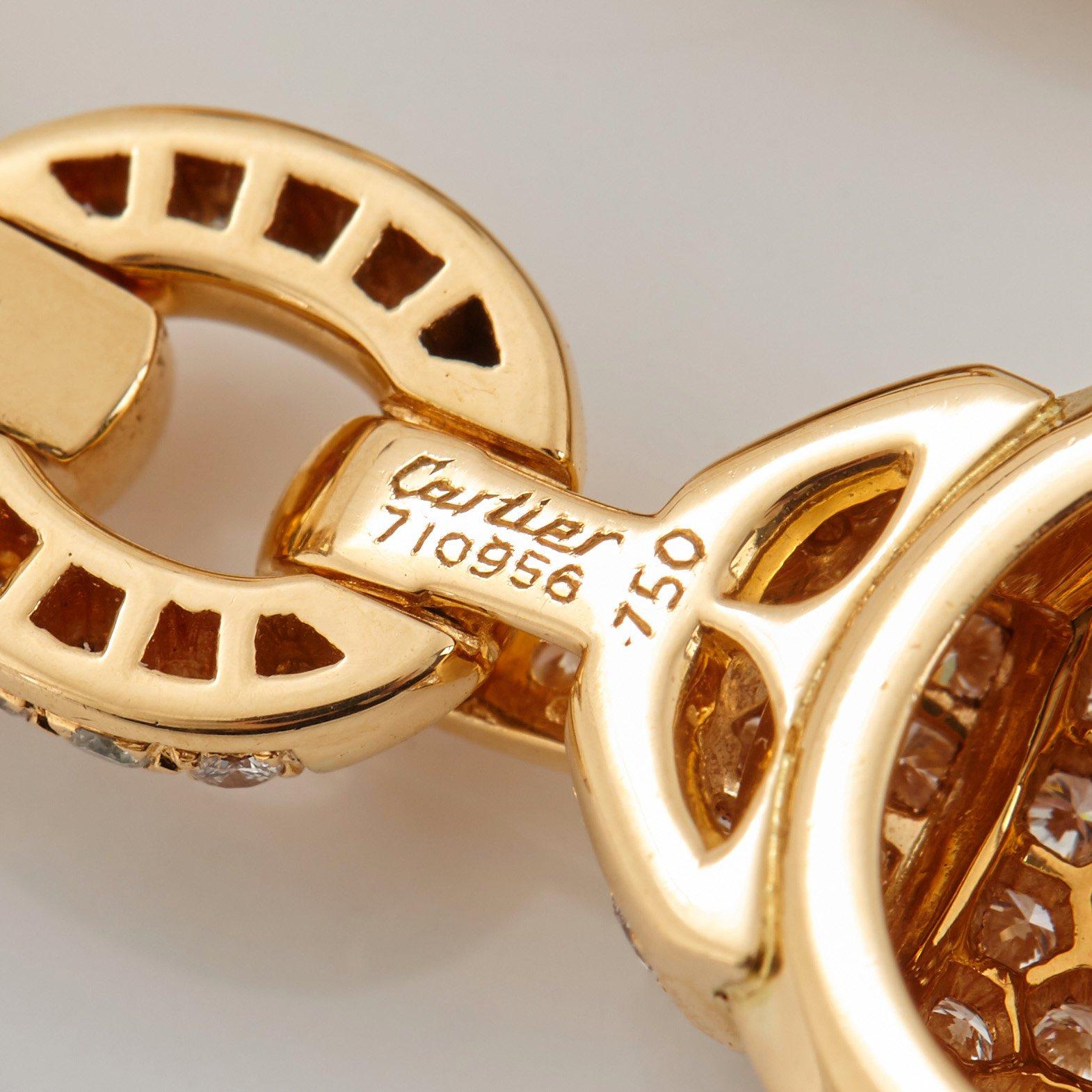 Cartier ett par örhängen 18K guld med runda briljantslipade diamanter.