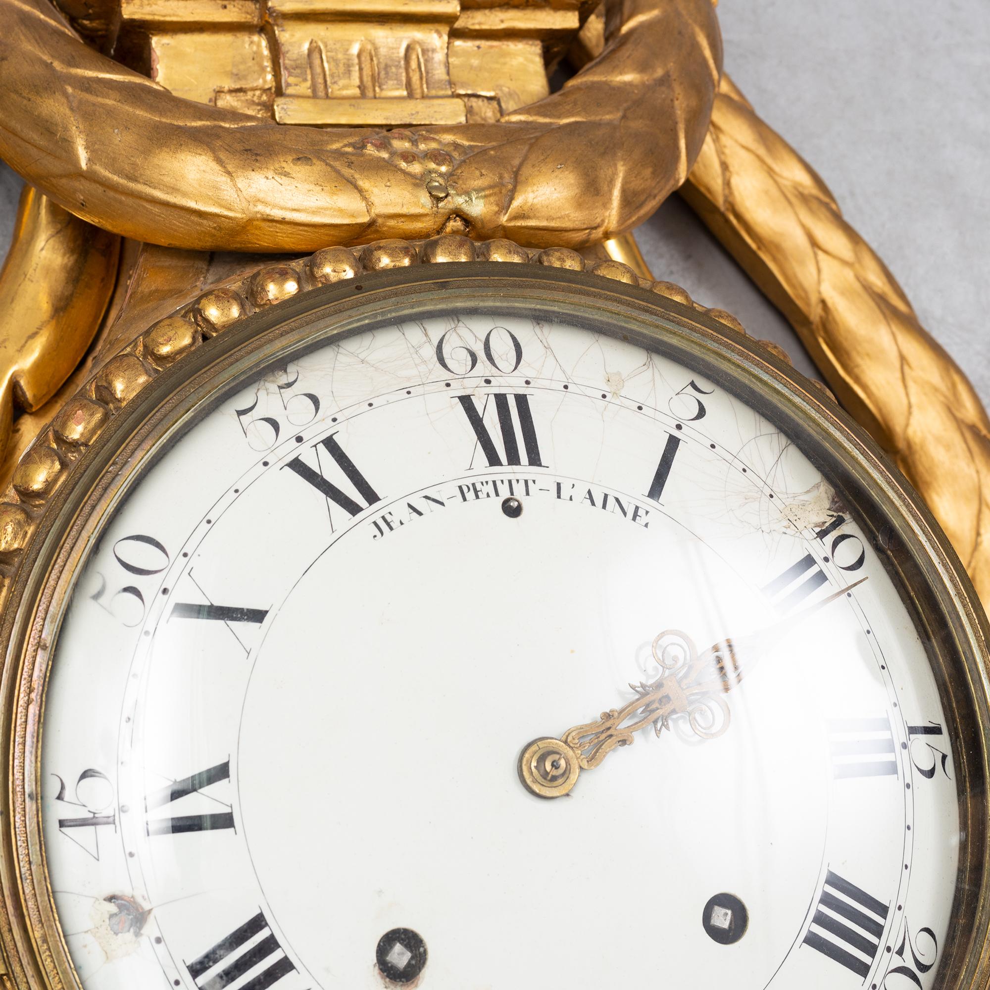 An 18th century Louis XV wall clock Jean-Petit L´Aine, Amsterdam.