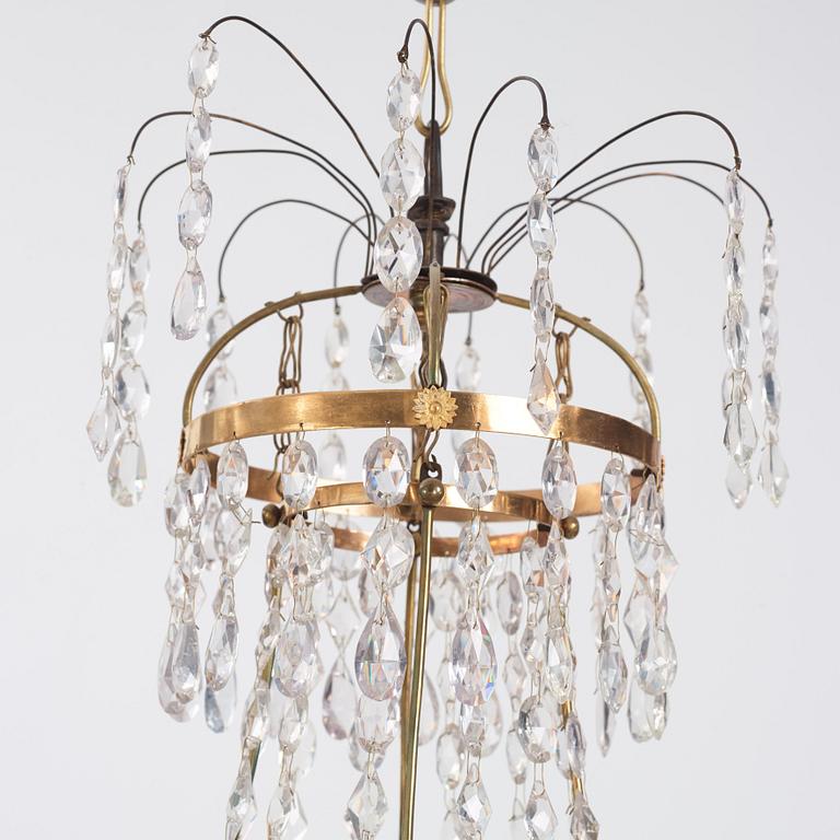 A late Gustavian four-light chandelier, early 19th century.
