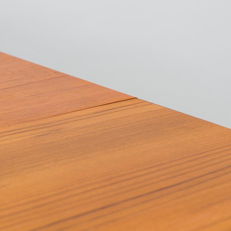 A mid-20th century dining table.