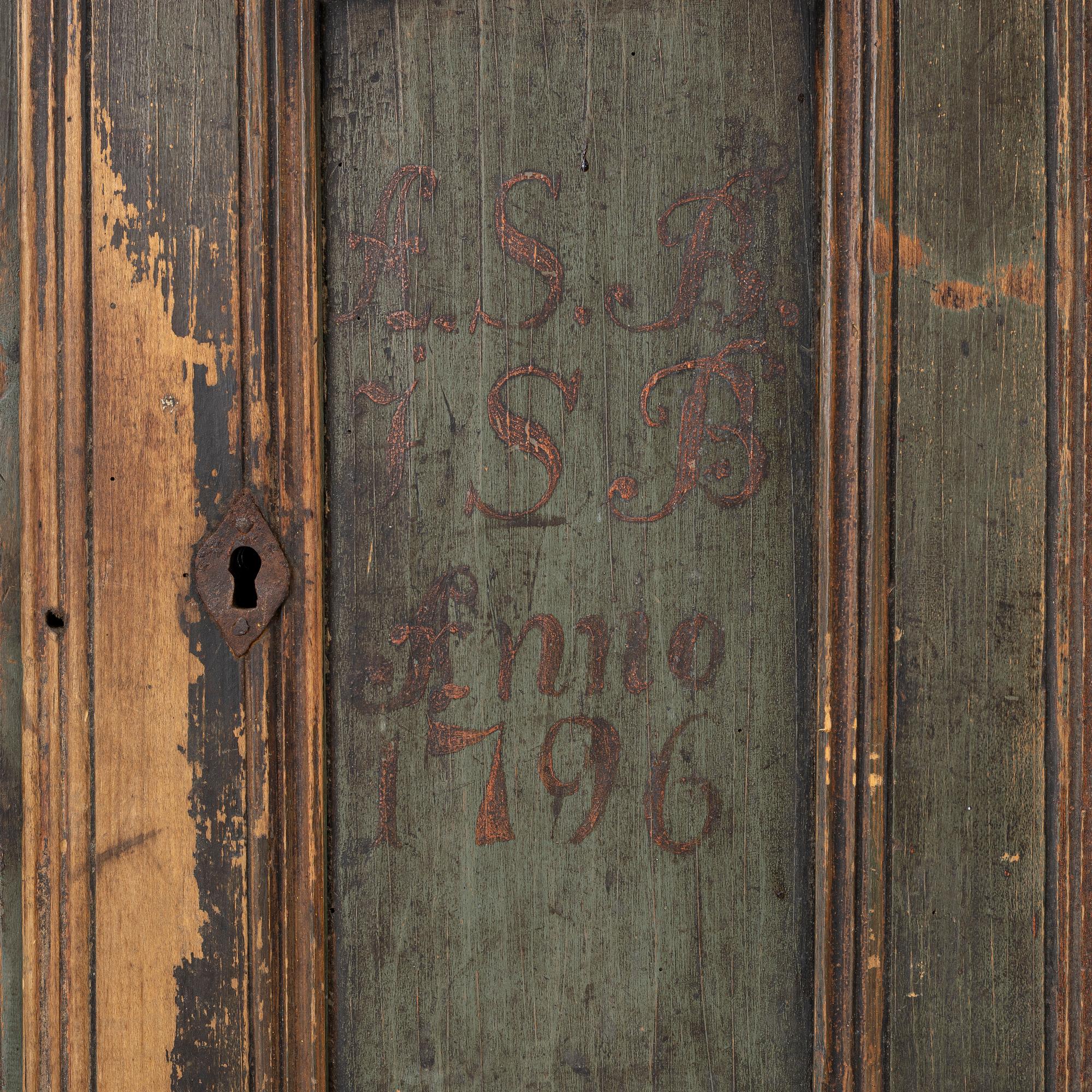A wall-hanged cabinet, Sweden, dated 1796.