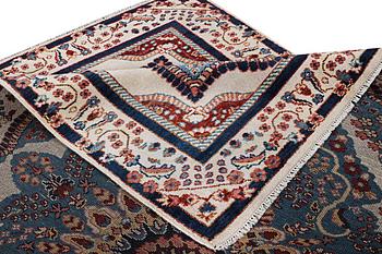 An oriental carpet with Mamluk design, c. 300 x 242 cm.