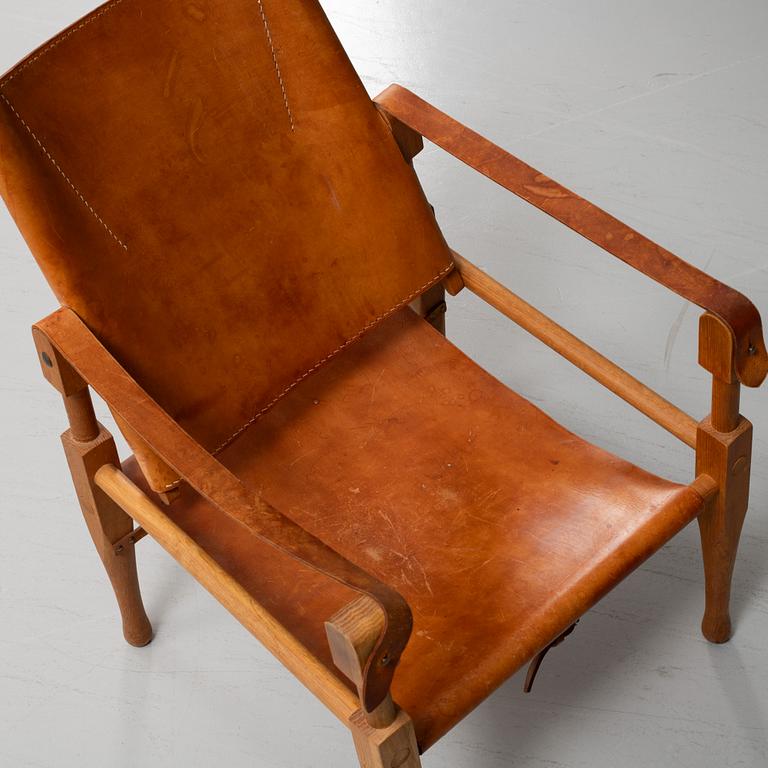 Scandianvian Modern, an oak and leather easy chair, mid 20th Century.