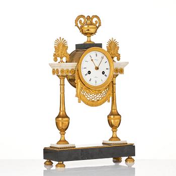 A late Louis XVI ormolu and marble portico clock, Paris, latge 18th century.