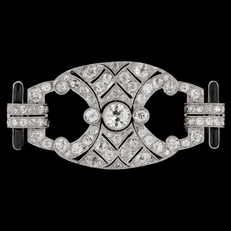 A brilliant cut diamond and black enamel Art Deco brooch, tot. app. 6 cts.