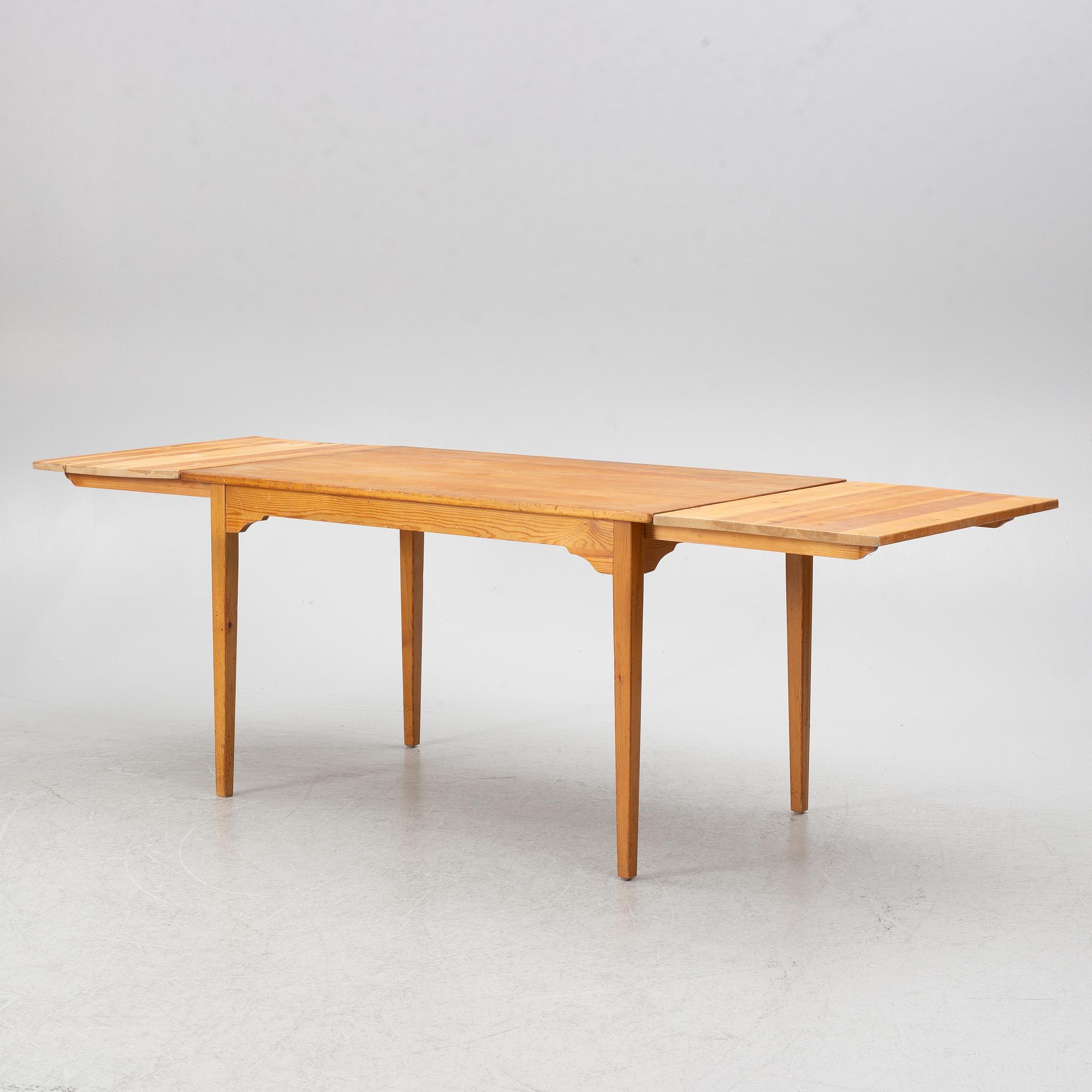 Carl Malmsten, dining table and four chairs, including Svensk Fur, second half of the 20th century.