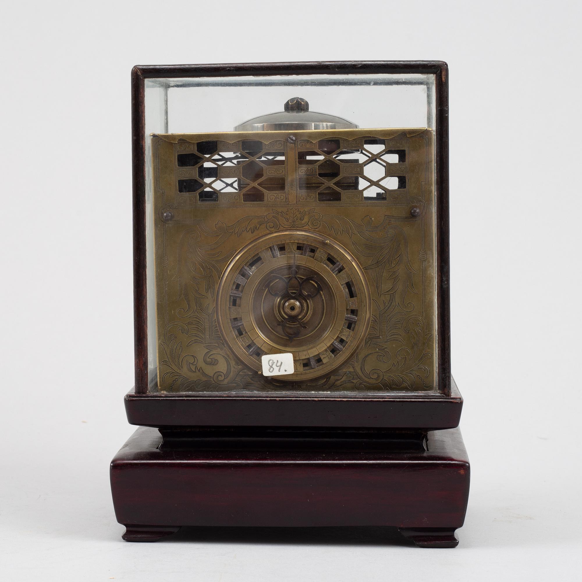 A Japanese brass mantel clock, 19th Century.