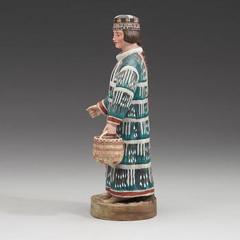 A Russian biscuit figure of a man of the Aleut people, circa 1900.