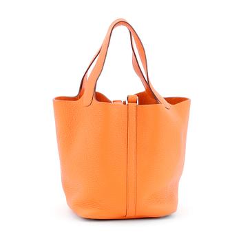 HERMÈS, a orange leather handbag, "Picotin lock".