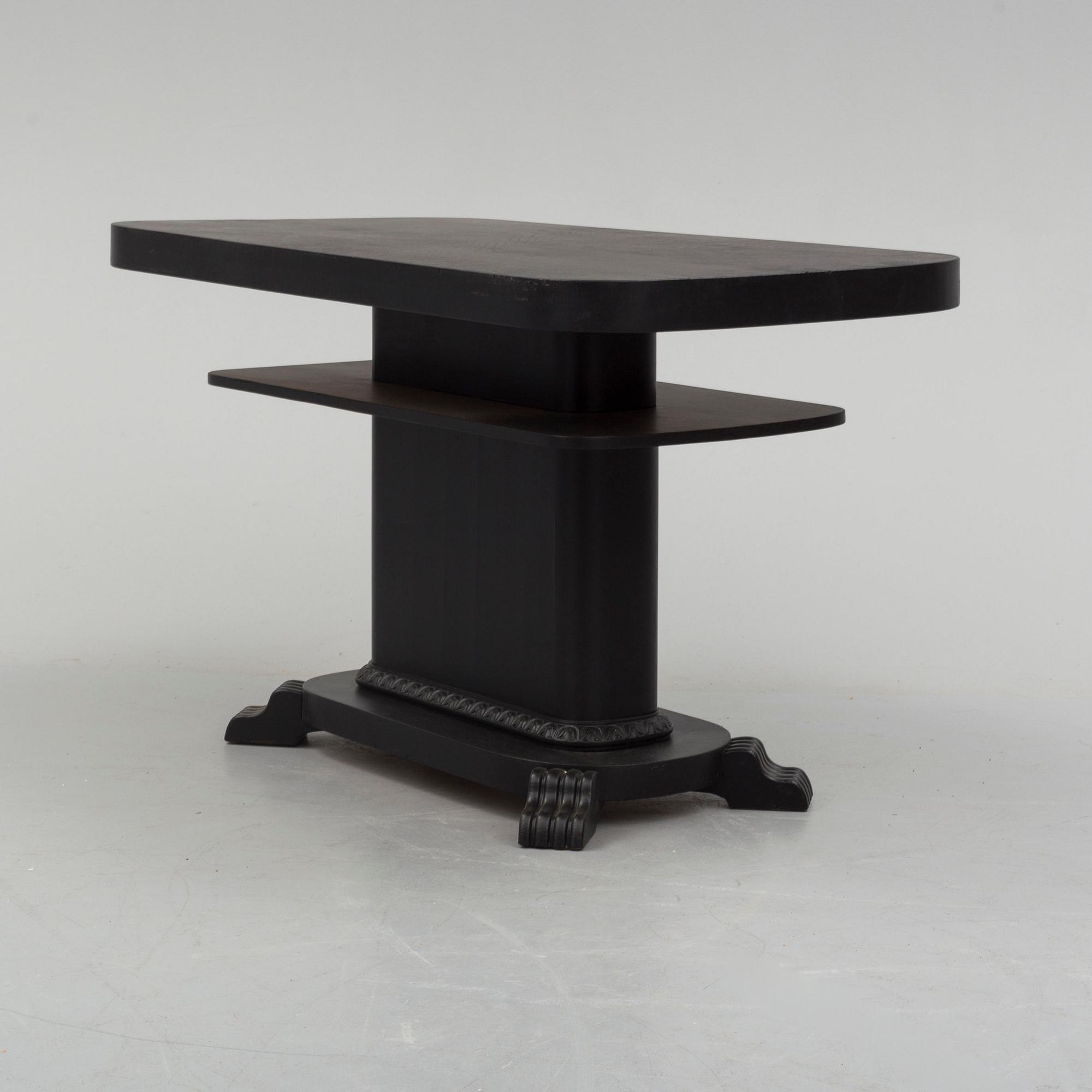 a coffee table from the first half of the 20th century.