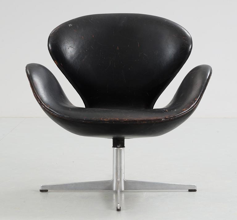 An Arne Jacobsen black leather 'Swan' easy chair, Fritz Hansen, Denmark 1960's.