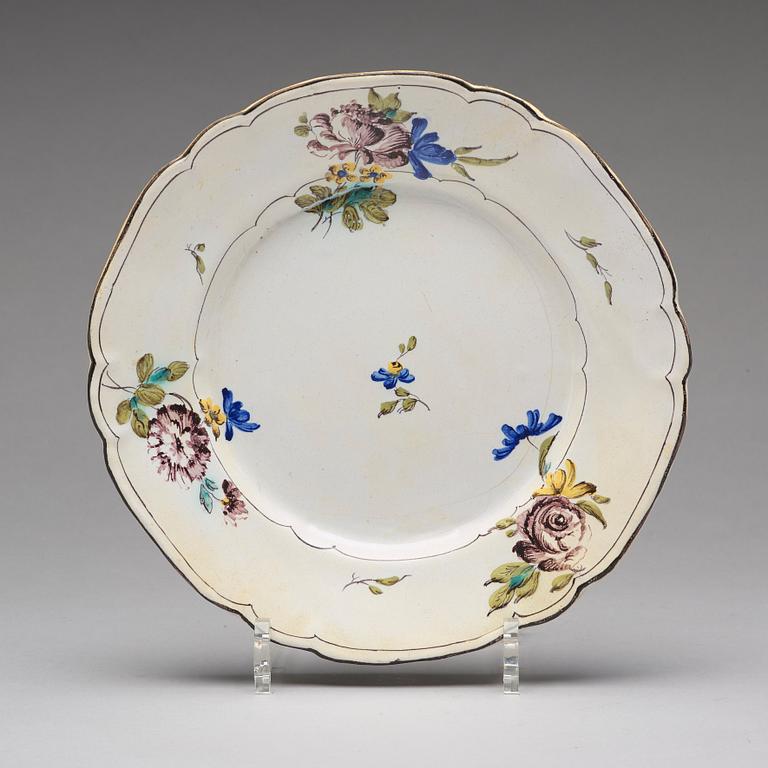 A set of six odd Swedish faience plates, Marieberg and Rörstrand, 18th Century.