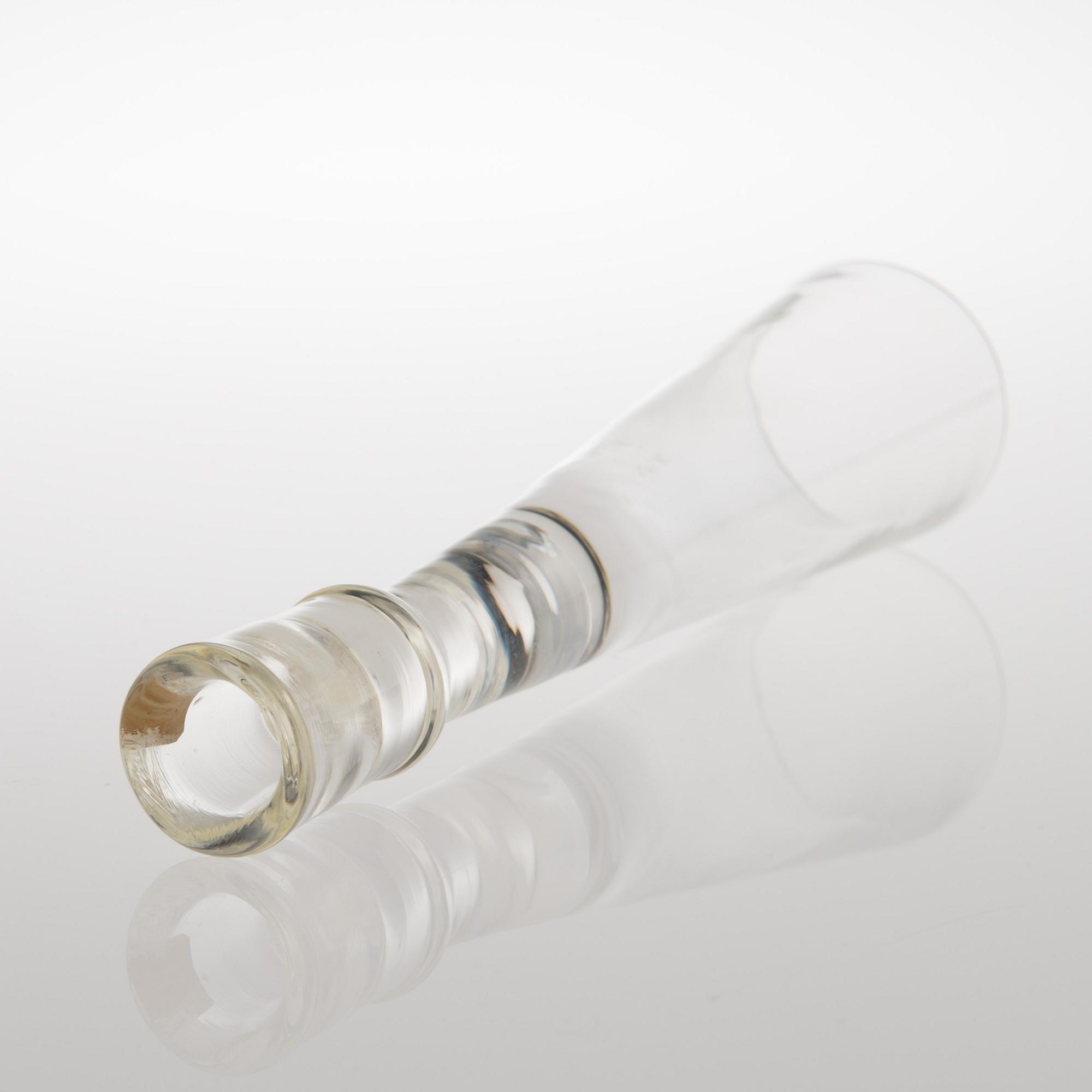 A GLASS CANDLESTICK, label marked Nuutajärvi Notsjö Boutique.