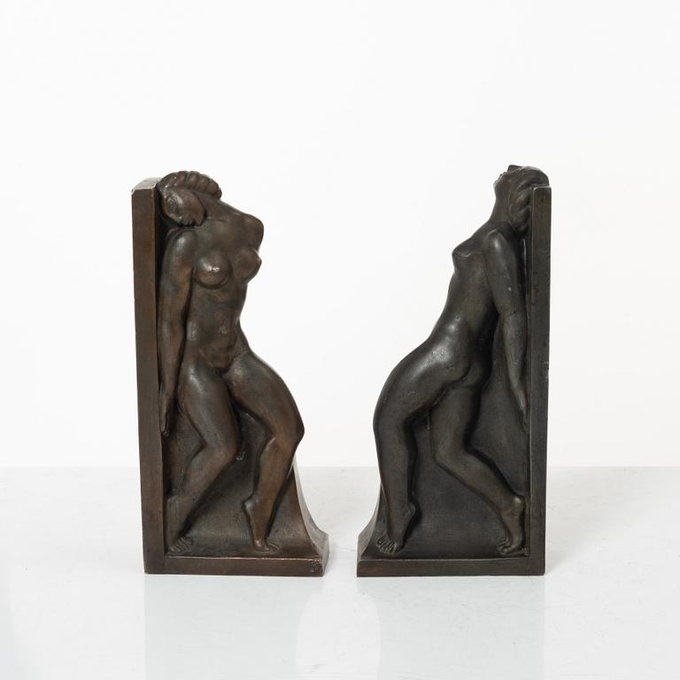 Axel Gute, two patinated metal bookends.