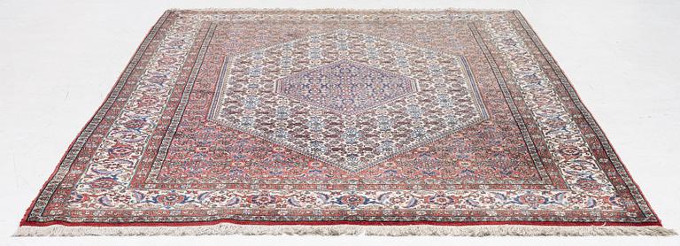 An oriental rug, approx. 238 x 174 cm.