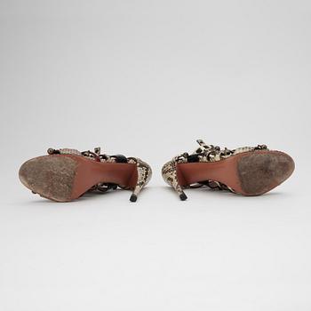 AZZEDINE ALAÏA, a pair of sandalettes with patent leather straps.
