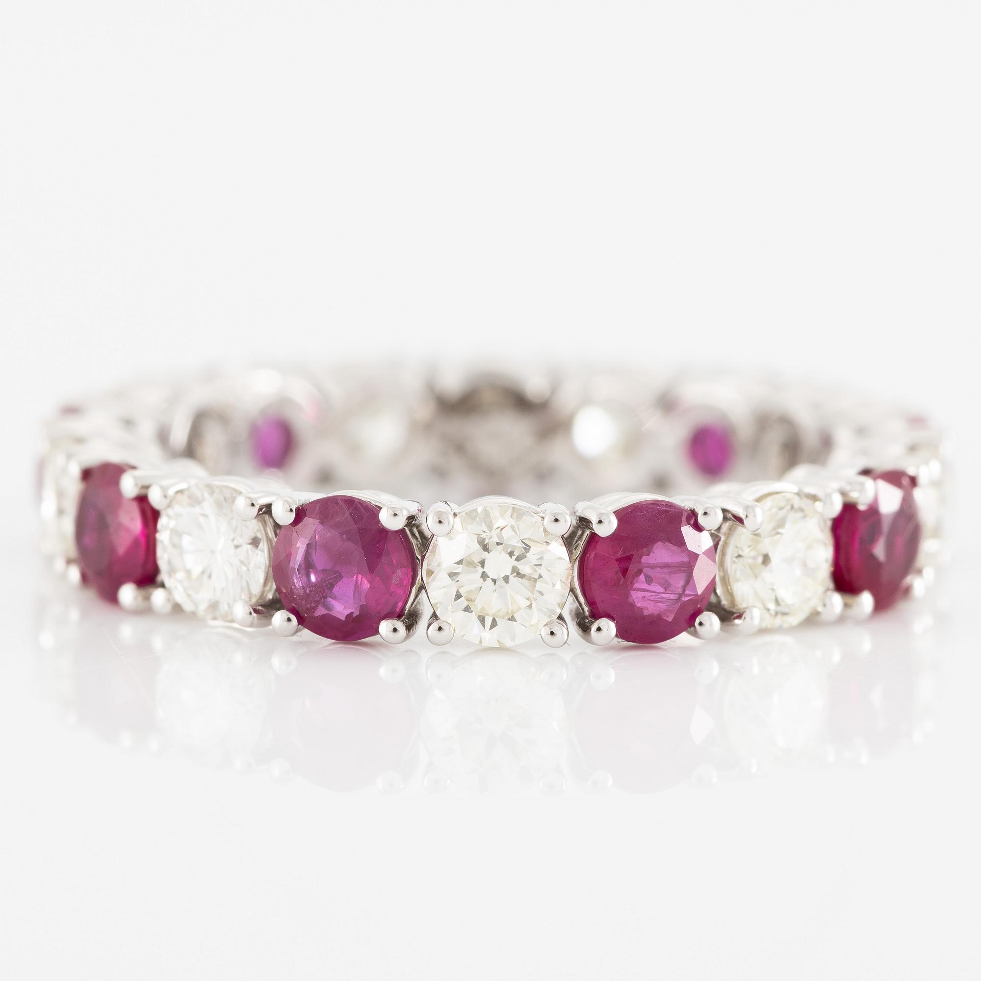 Ring, full eternity band, 18K white gold set with rubies and brilliant-cut diamonds.