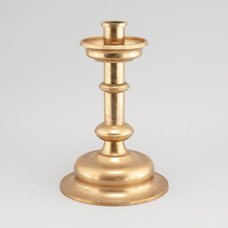 A brass candlestick by Erik Jonsson, Skara from the second half of the 20th century.