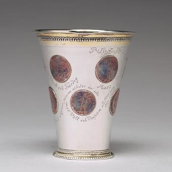 A Swedish 18th century parcel-gilt silver beaker with copper coins, mark of CM Ekman, Eksjö (1729-1738).