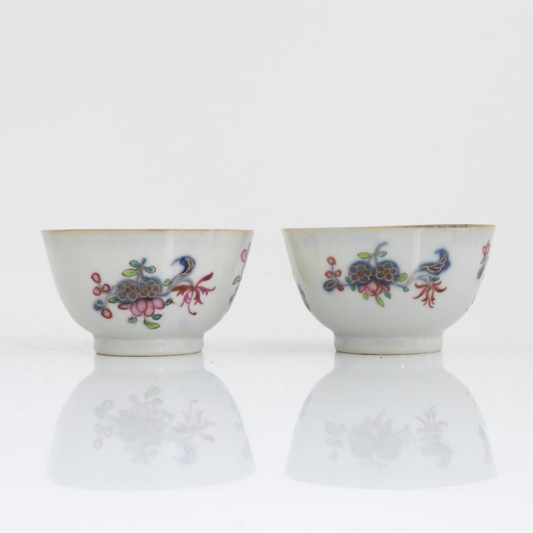 Twelve Chinese famille rose cups on stands, Qing dynasty, Qianlong (1736-95).