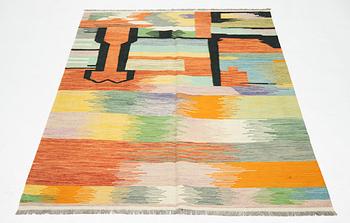 A kilim rug, 247 x 170 cm.