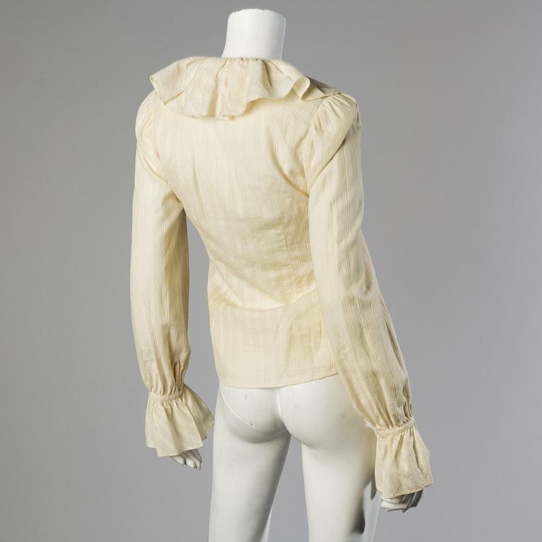 A wool/alpaca jacket by Ralph Lauren and two blouses.