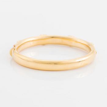 An 18K gold David Morris bangle set with citrines and round brilliant-cut diamonds.