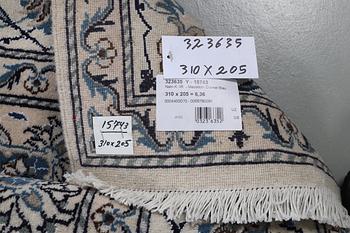 A carpet, Nain, part silk, ca 310 x 205 cm.