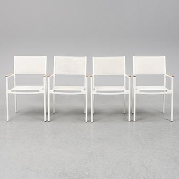 A garden table with four chairs, Gloster.