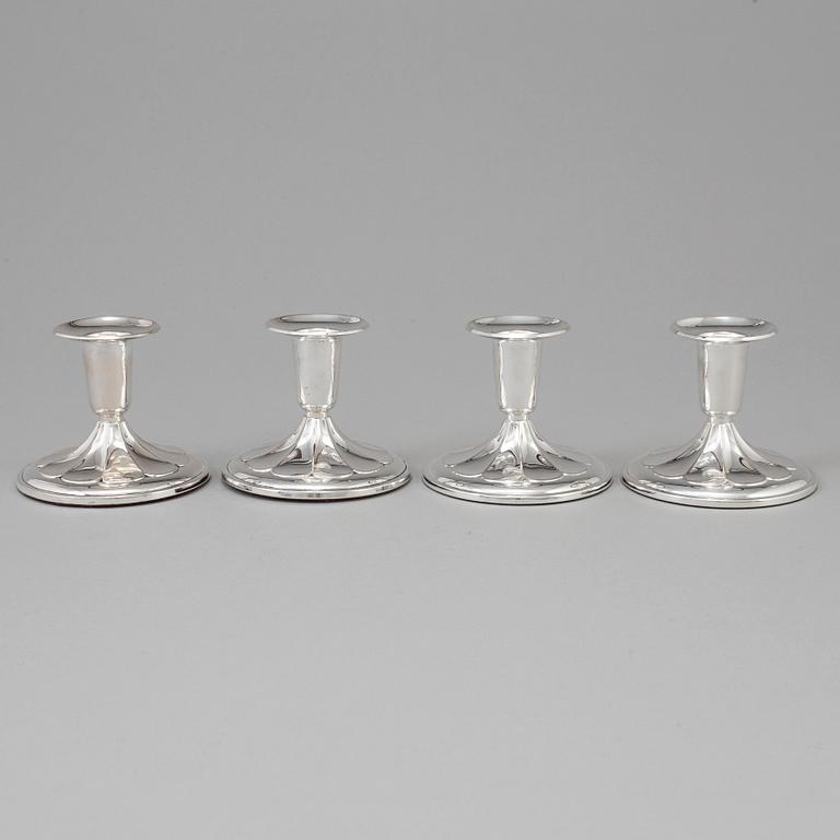 A set of four silver Candlesticks,