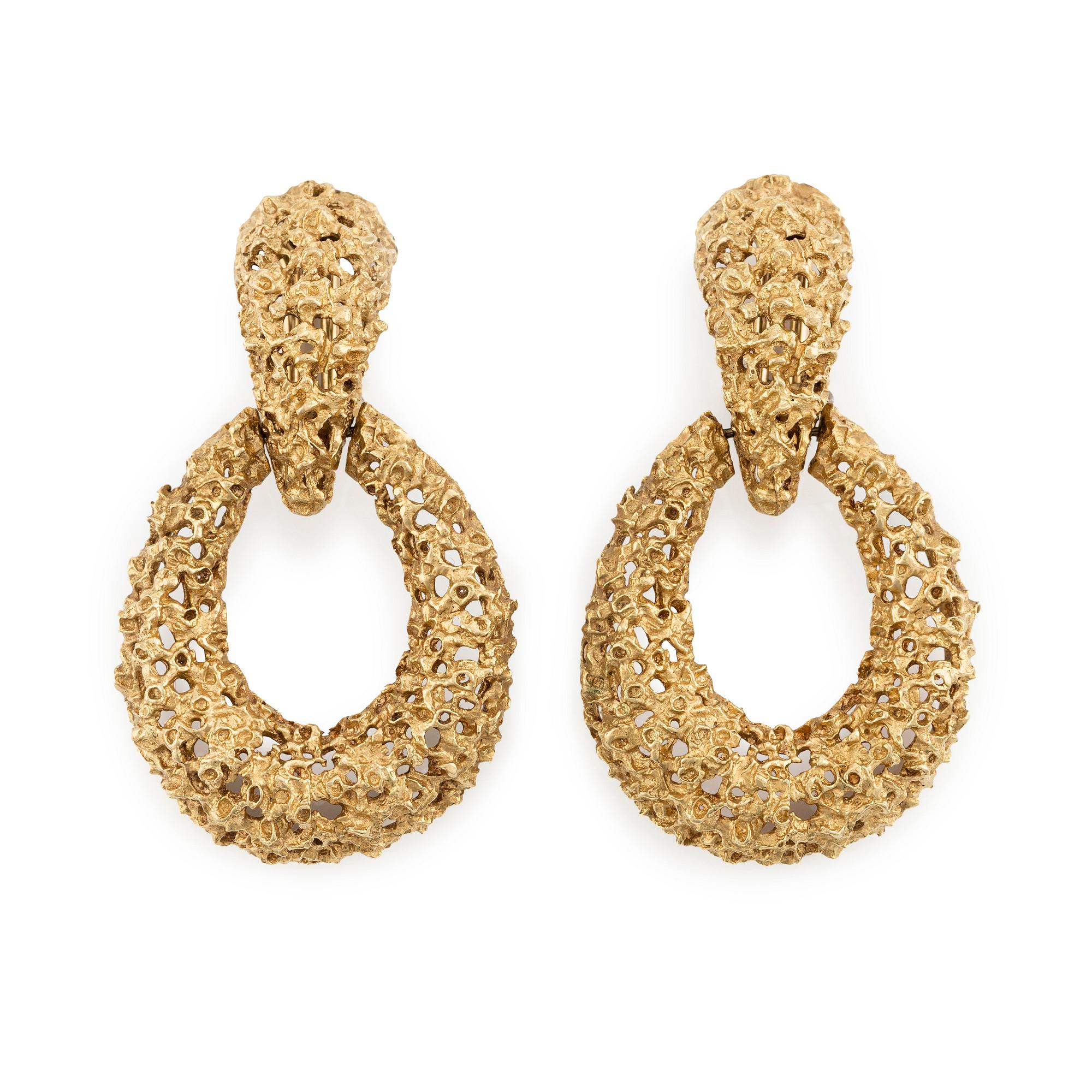 A pair of 18K gold earrings.