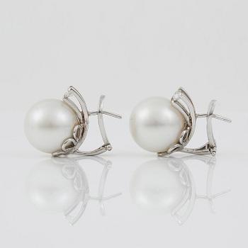 A pair of cultured South sea pearl and diamond earrings. Total carat weight of diamonds circa 0.35 ct.