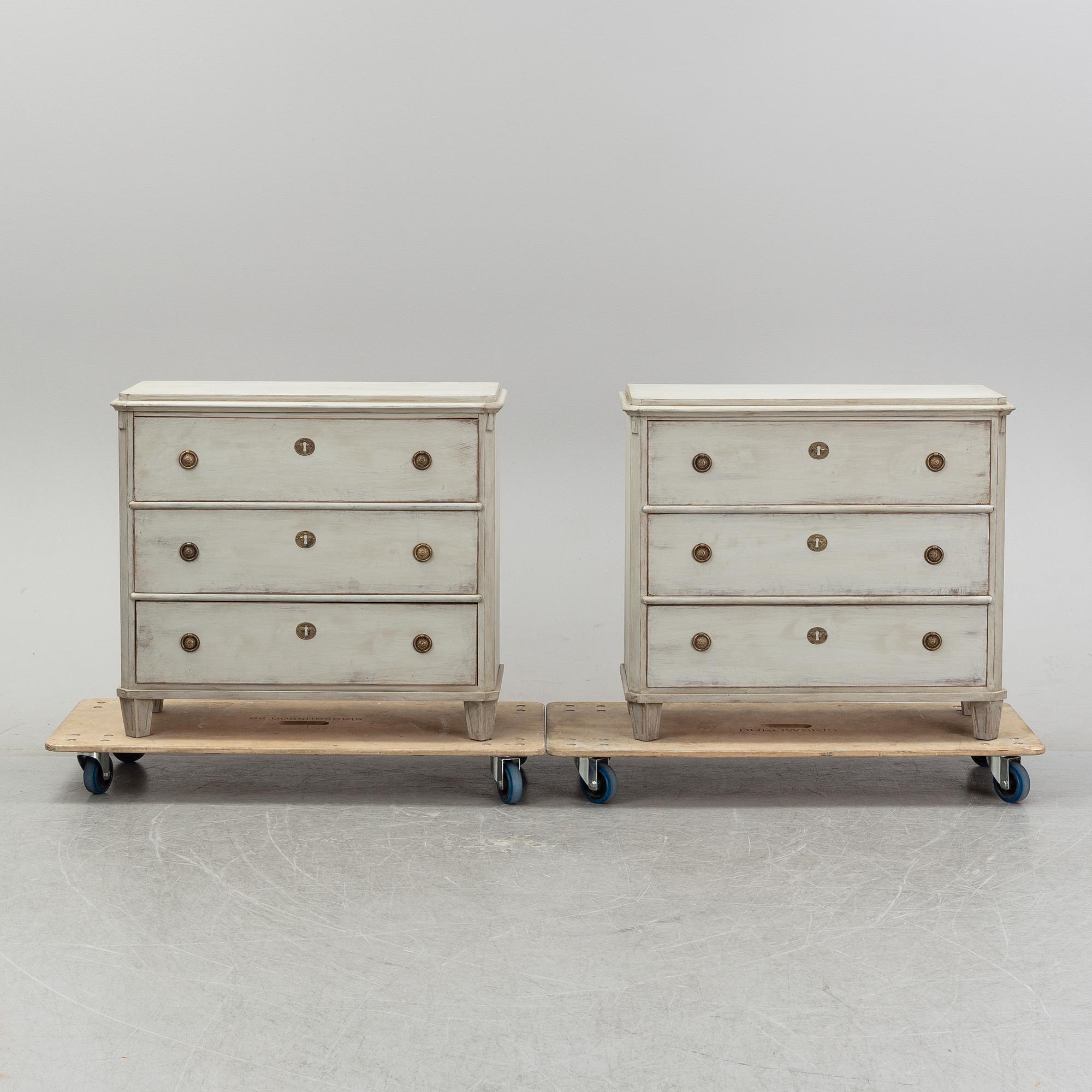 A pair of painted late gustavian-style chest of drawers.
