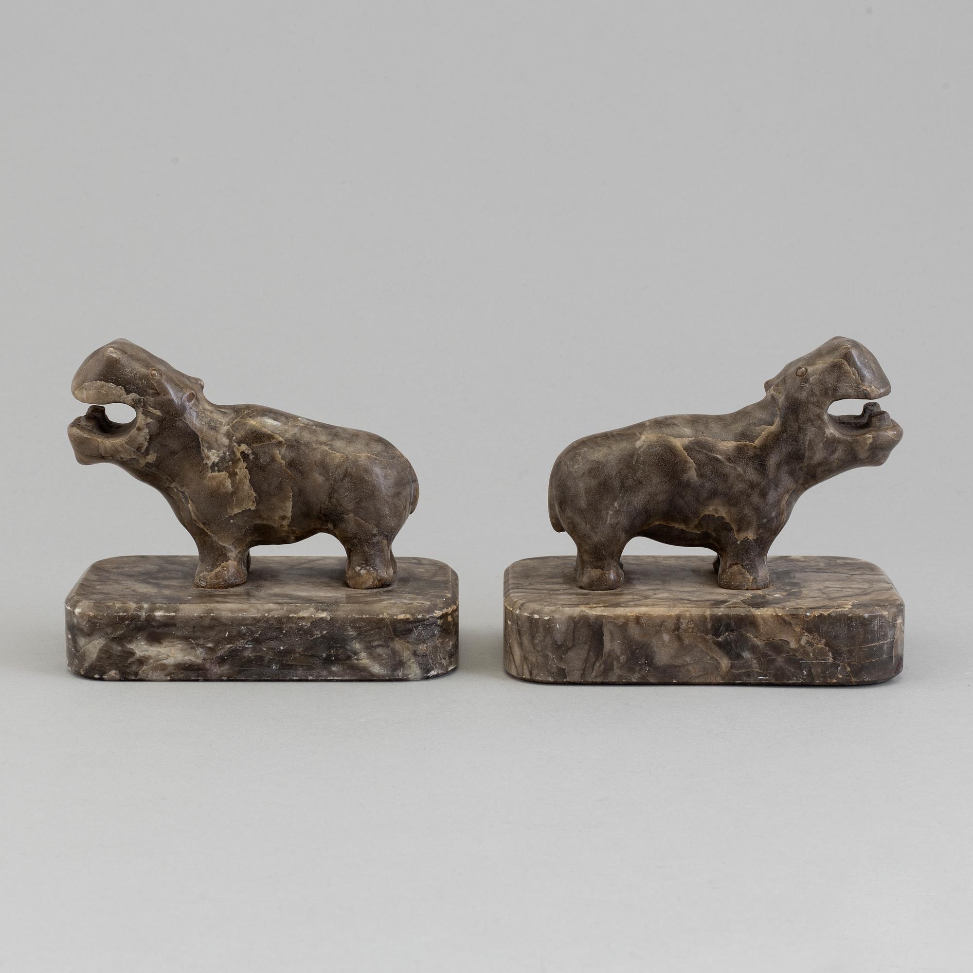 A pair of stone book ends, early 20th century.