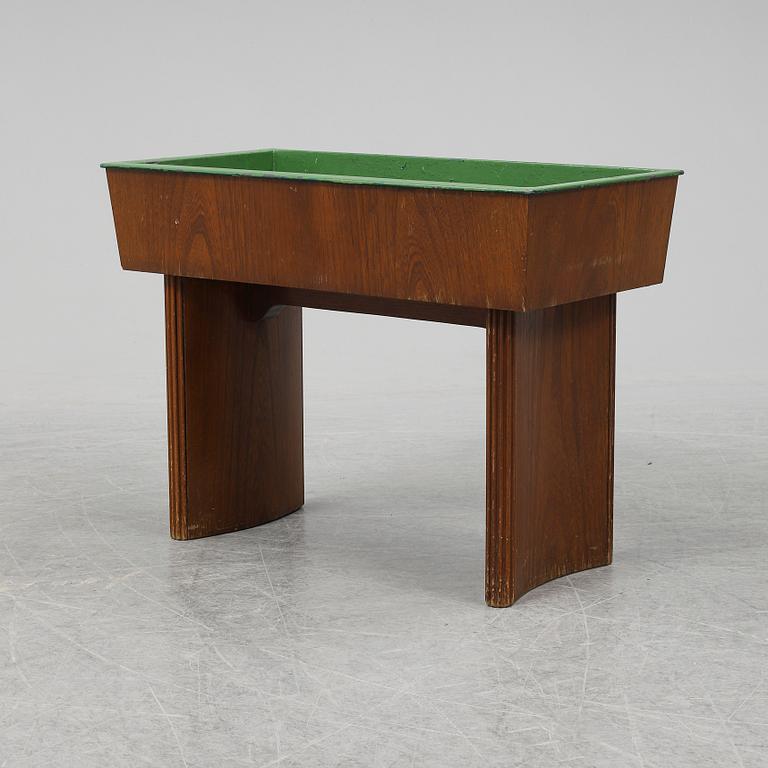 NORDISKA KOMPANIET, possibly be Carl Axel Acking, an oak plant stand from 1942.