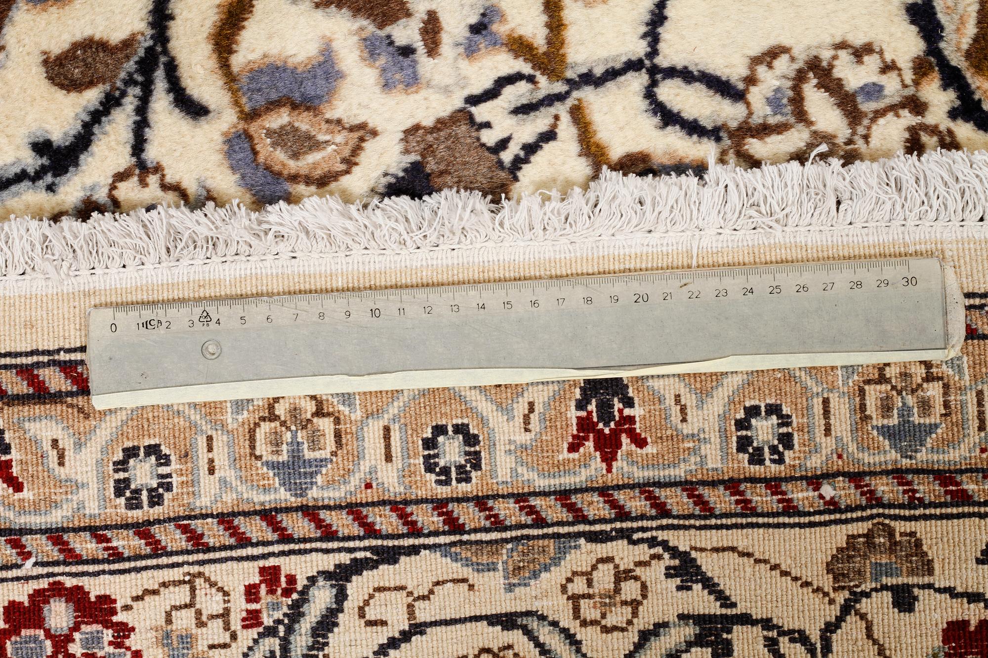 A CARPET, Nain, part silk, around 340 x 241 cm.