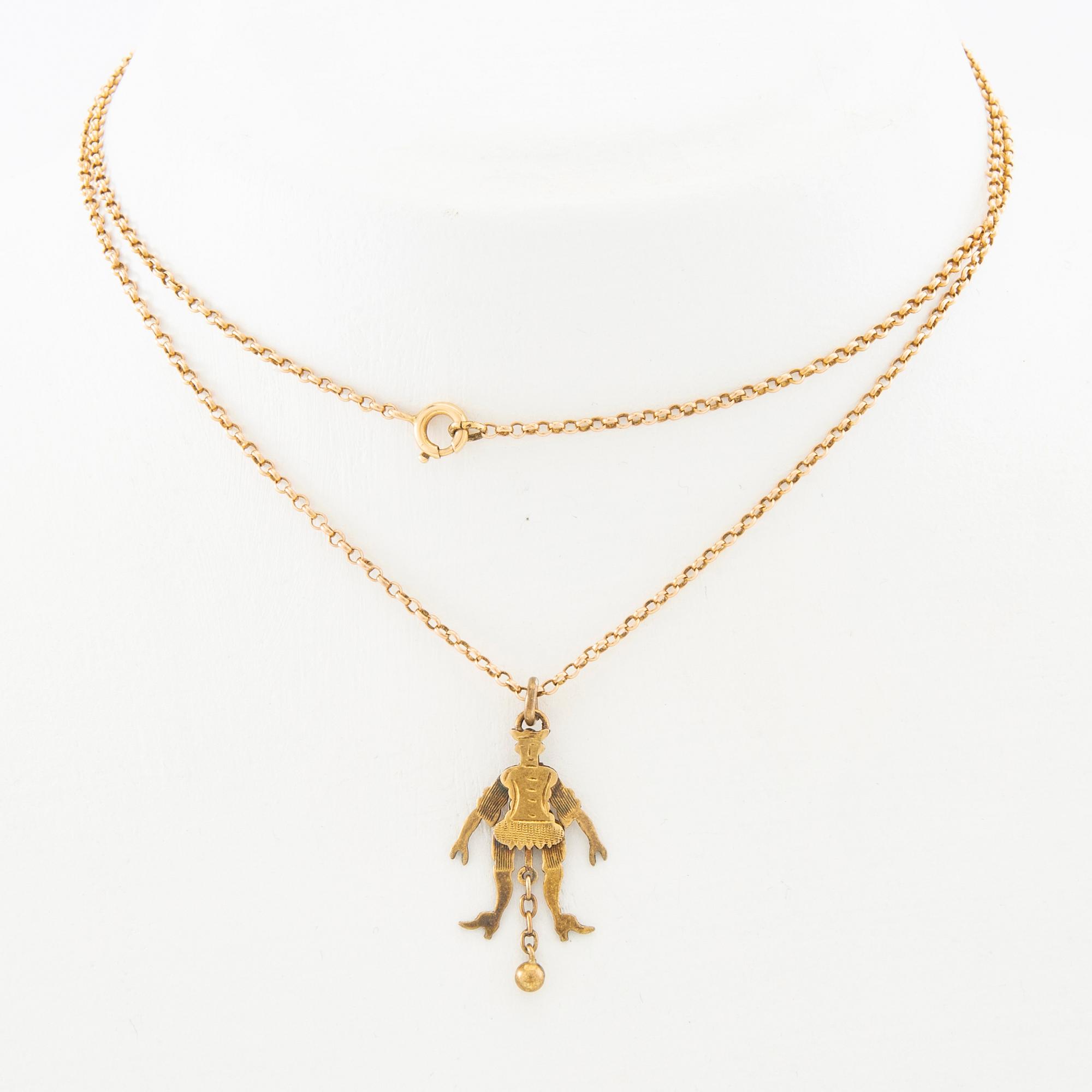 Halsband med kedja av 18K guld, hänge i form av en "sprattelgubbe" av 8K guld.