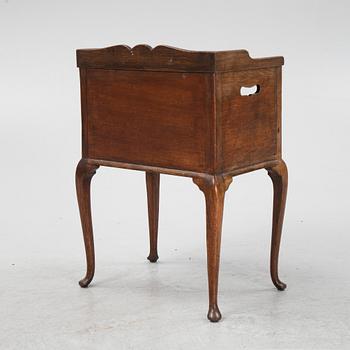 A rococo style bedside table, early 20th Century.