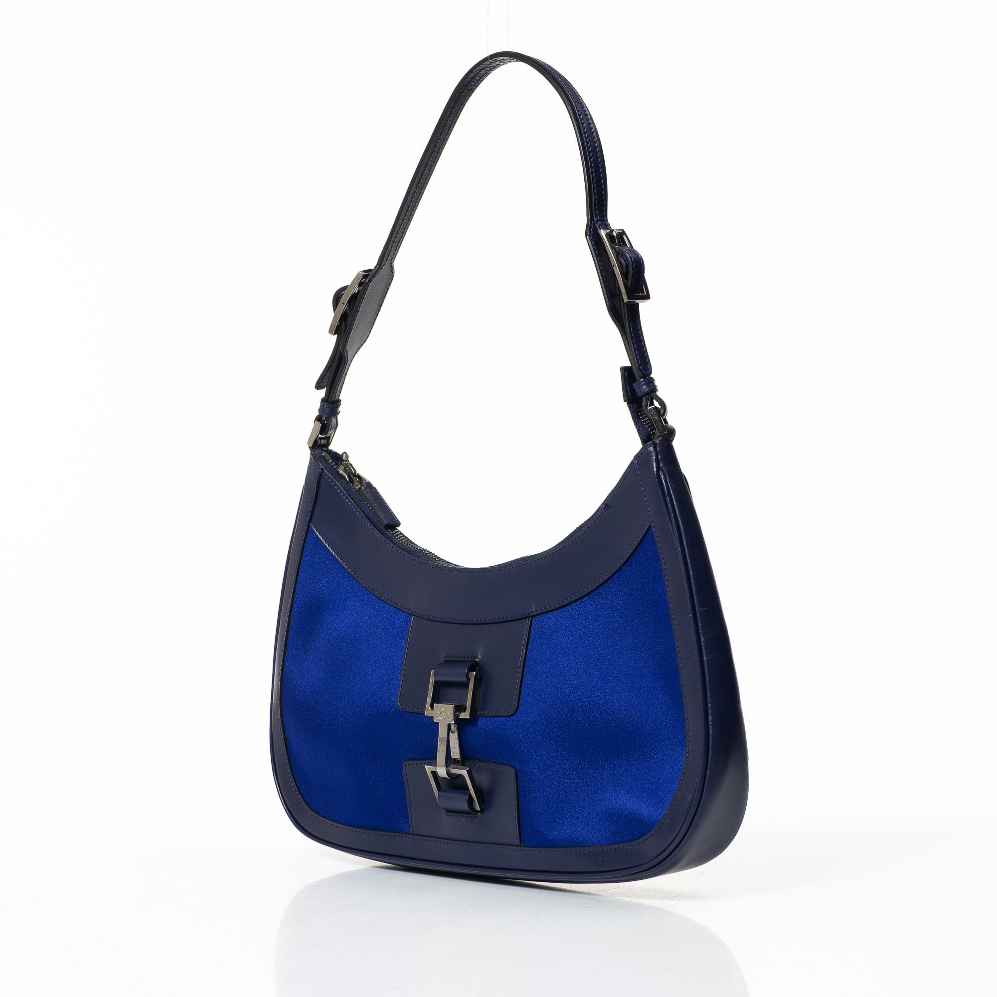 Gucci, a blue leather and fabric bag.