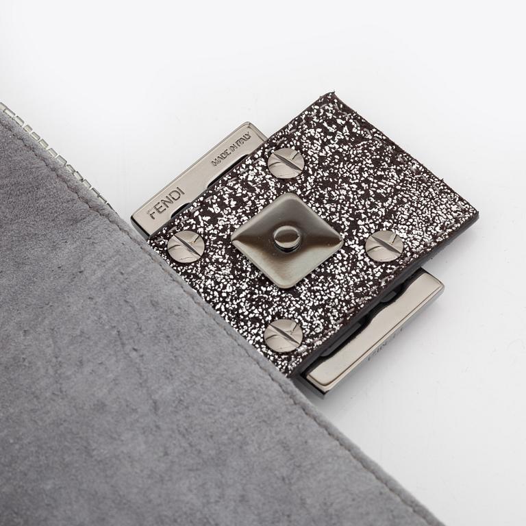 Fendi, a beaded baguette bag.