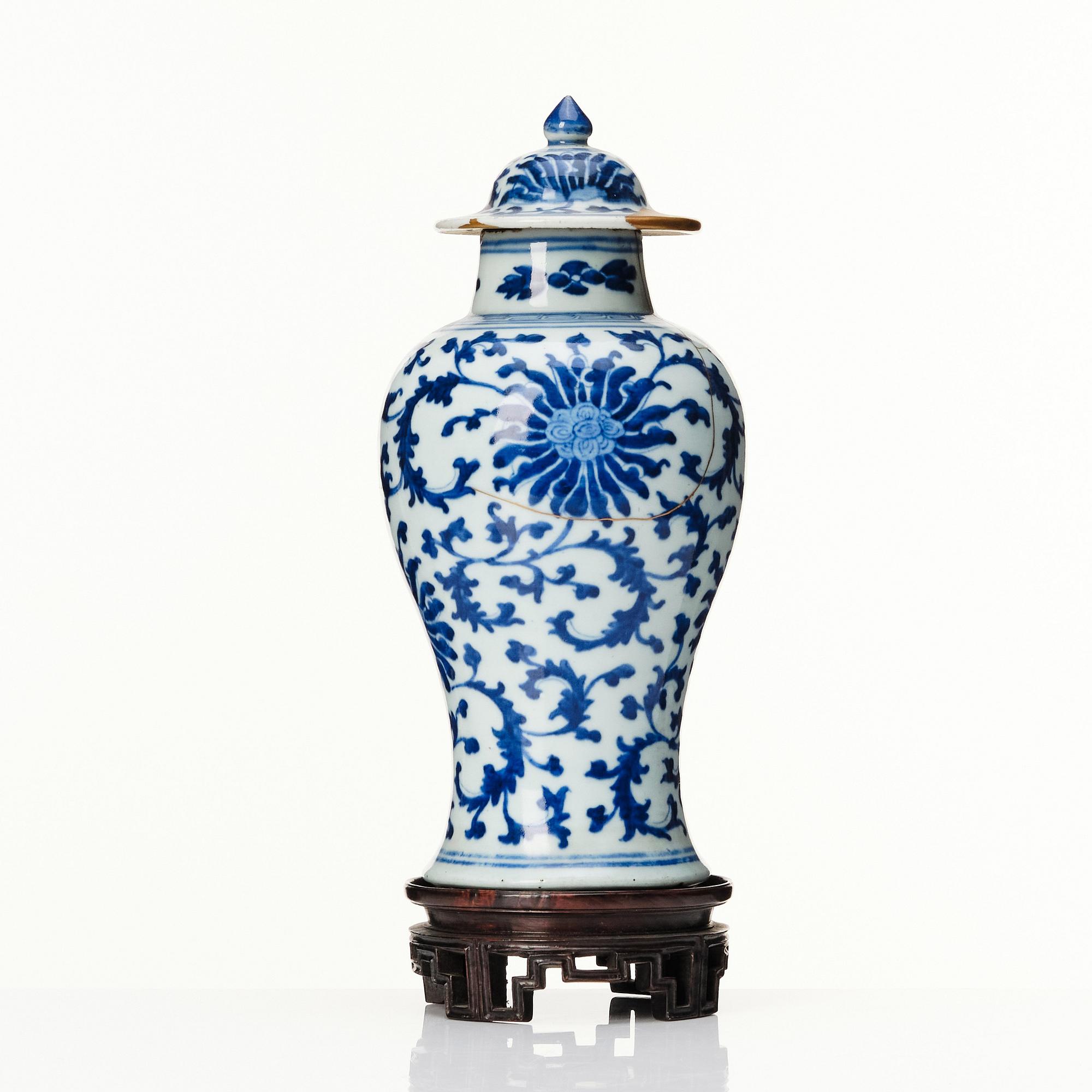 A Chinese blue and white lotus vase with cover, Qing dynasty, 18th Century.