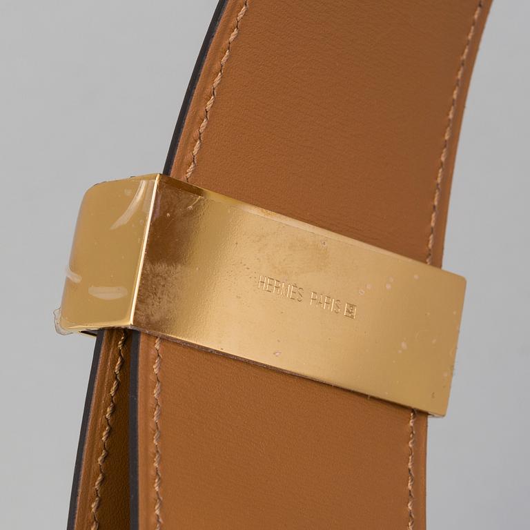 A belt by Hermès "Collier de Chien".