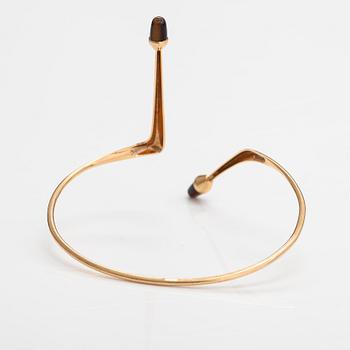 Elis Kauppi, A 14K gold bracelet/bangle with tiger's eyes. Kupittaan kulta, Turku 1961.