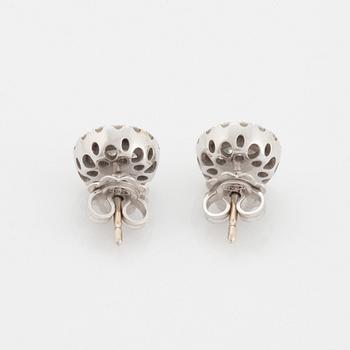 A pair of 18K white gold earrings.