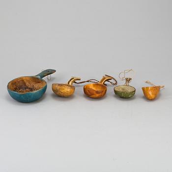 A set of five amongst others Sami cups made of birchwood and reindeer antlers.